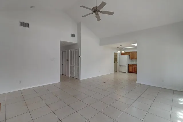 a kitchen with cabinets stainless steel appliances and window