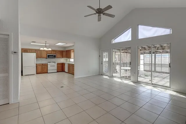 a kitchen with a stove sink and cabinets