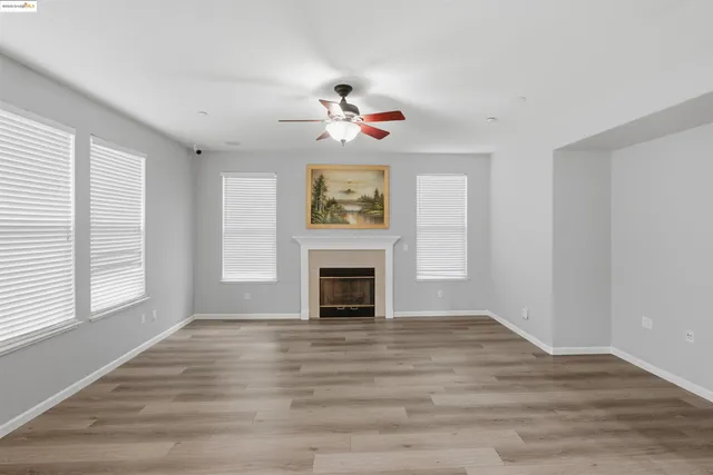 a view of a livingroom with a fireplace window and a fireplace
