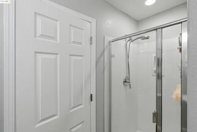 a view of a livingroom with furniture wooden floor and windows