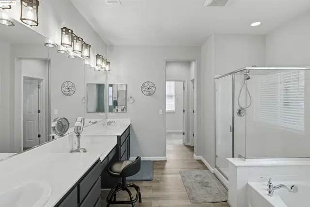 a bathroom with a shower and a sink