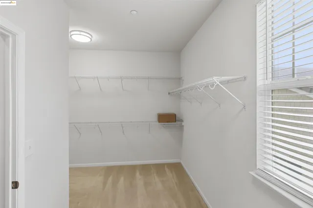 a bathroom with a sink a light fixture and a mirror