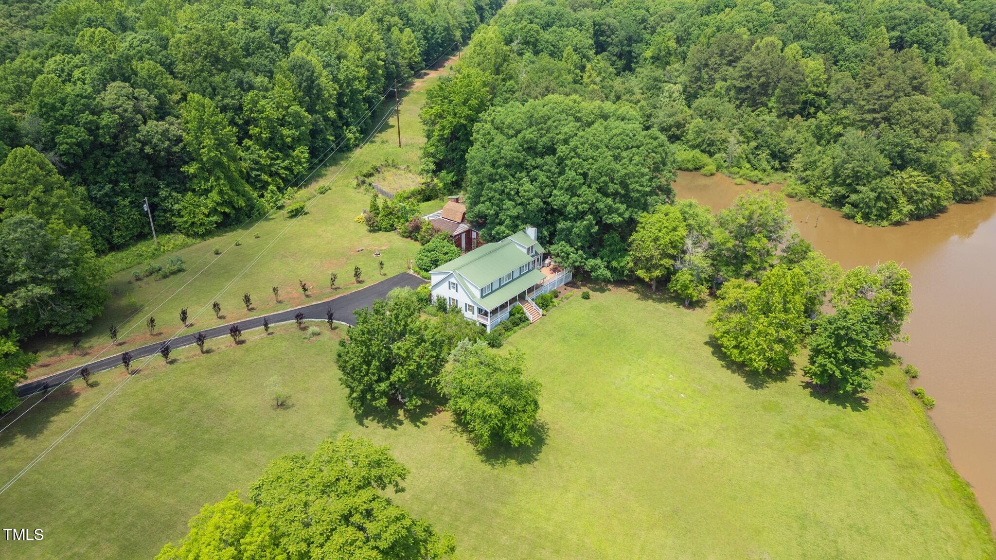 a view of a yard with a swimming pool