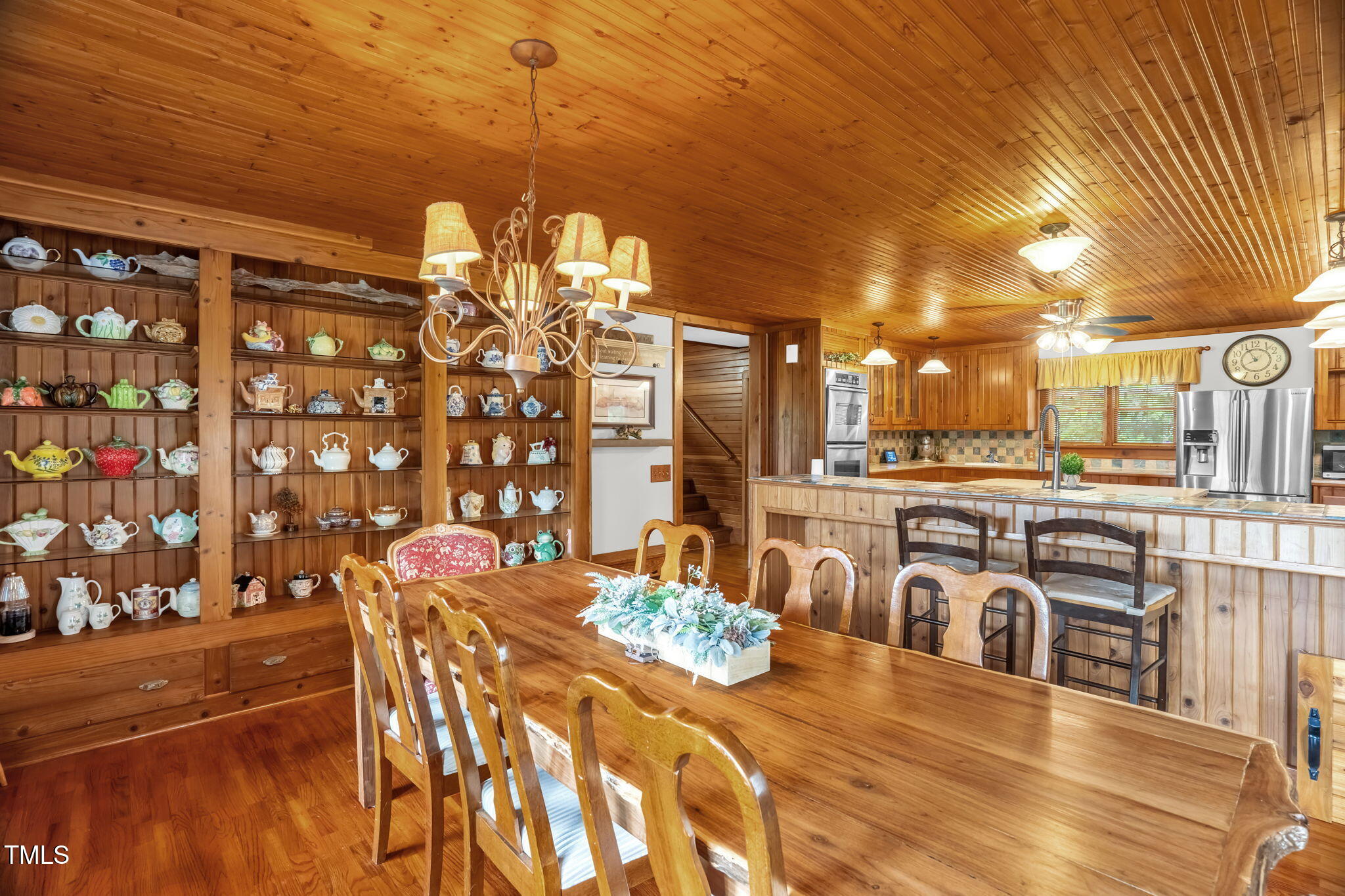 771 Cedar Grove Church Road Roxboro, NC 27574 - Photo 12 of 45 a view of a dining room with furniture and chandelier