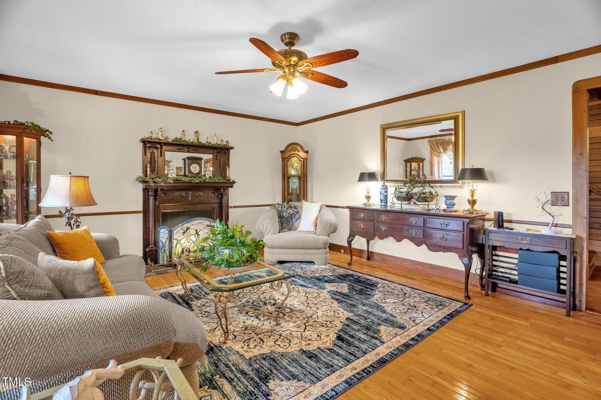771 Cedar Grove Church Road Roxboro, NC 27574 - Photo 2 of 45 a living room with furniture and a wooden floor