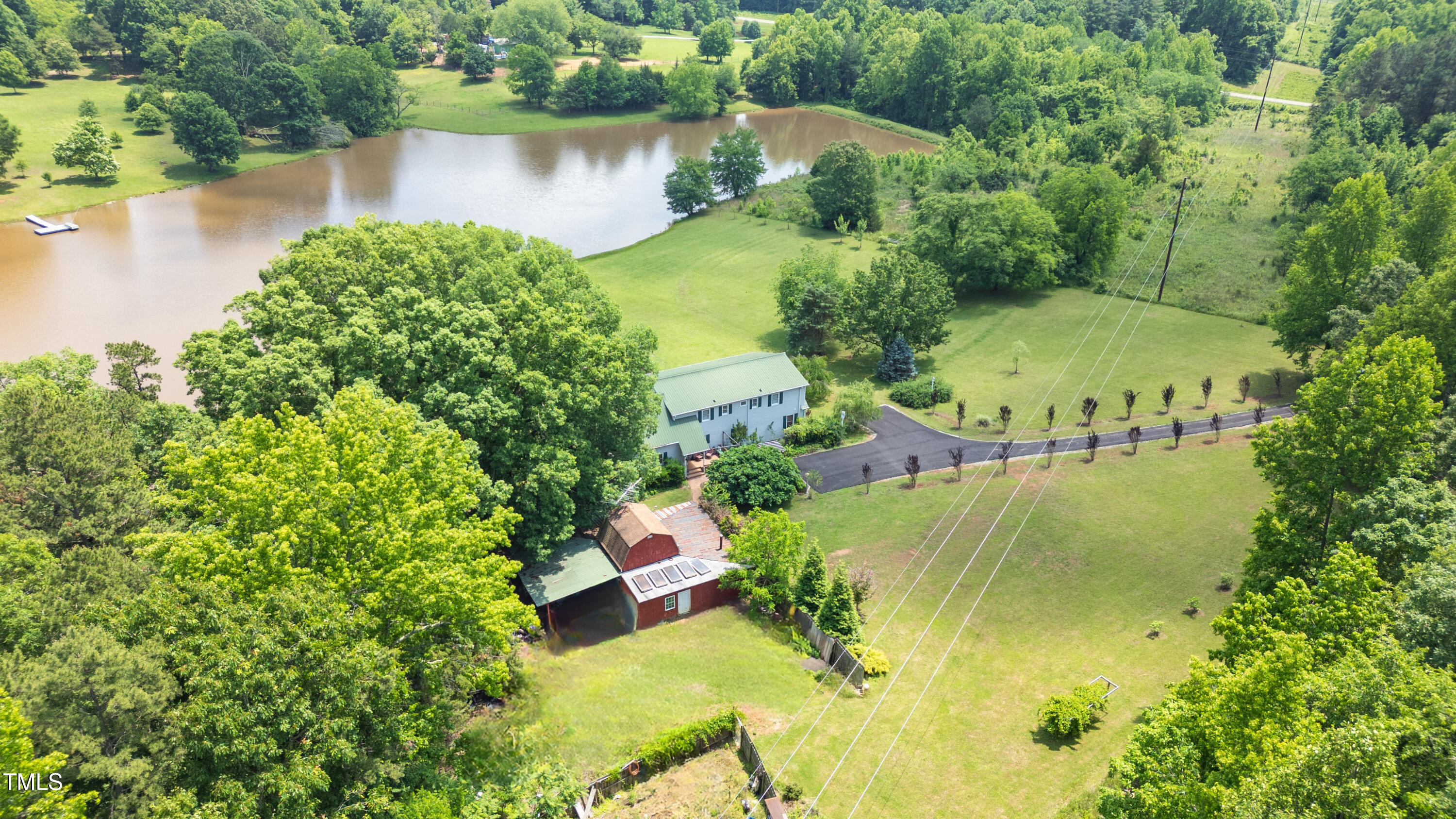 771 Cedar Grove Church Road Roxboro, NC 27574 - Photo 40 of 45 an aerial view of residential house with outdoor space and lake view