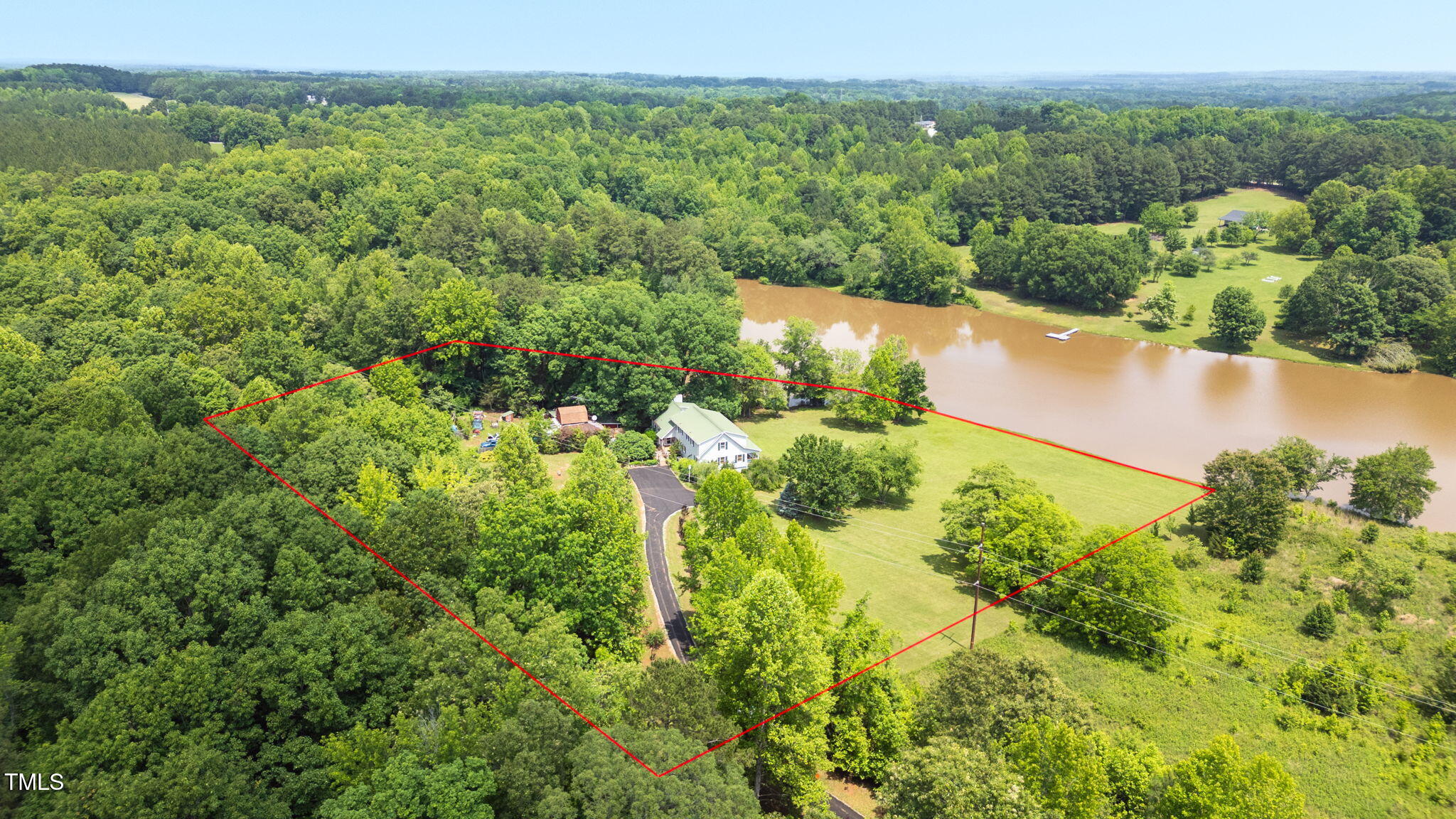 771 Cedar Grove Church Road Roxboro, NC 27574 - Photo 41 of 45 a view of a lake with a city