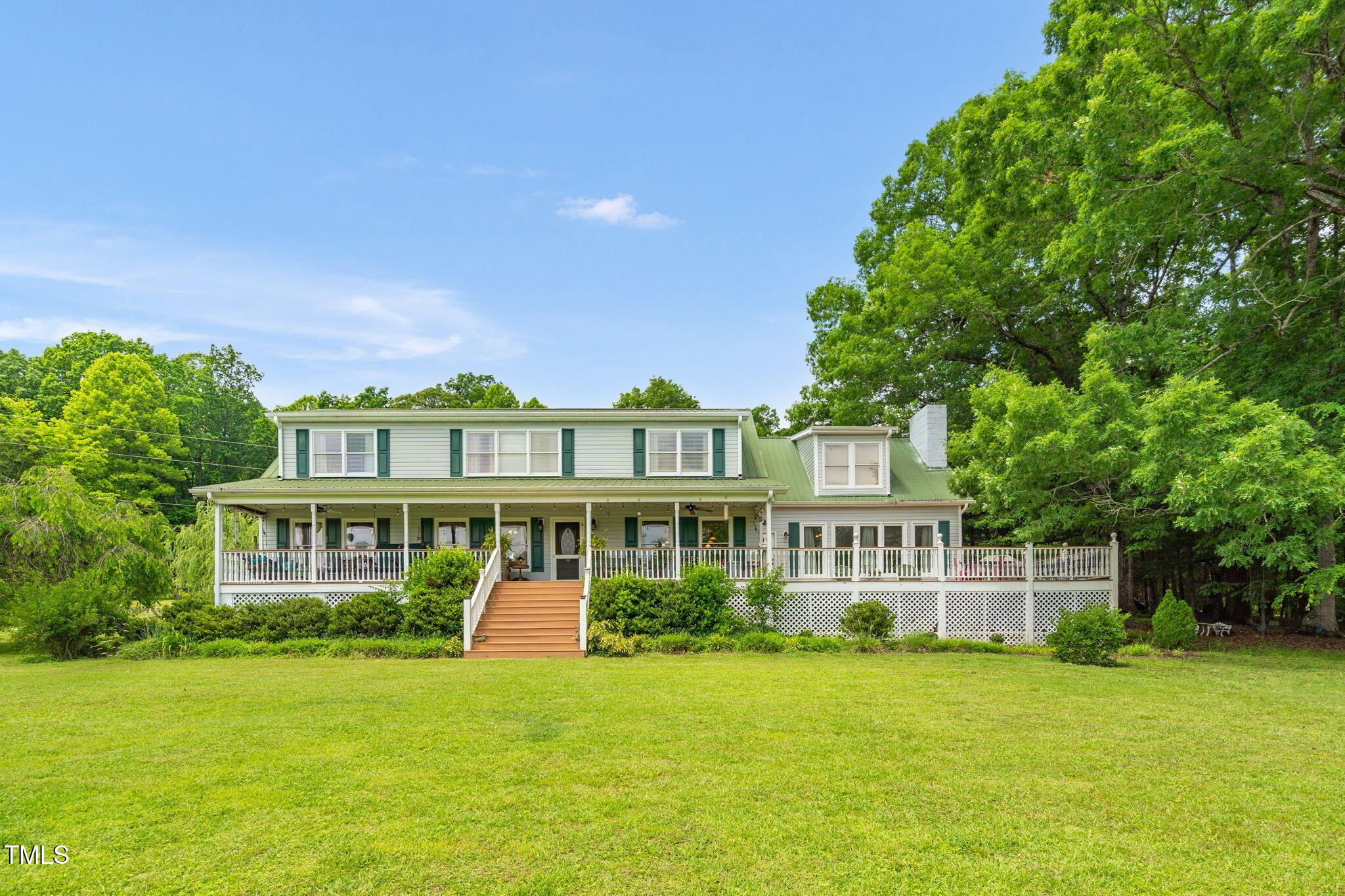 771 Cedar Grove Church Road Roxboro, NC 27574 - Photo 4 of 45 a front view of a house with a garden