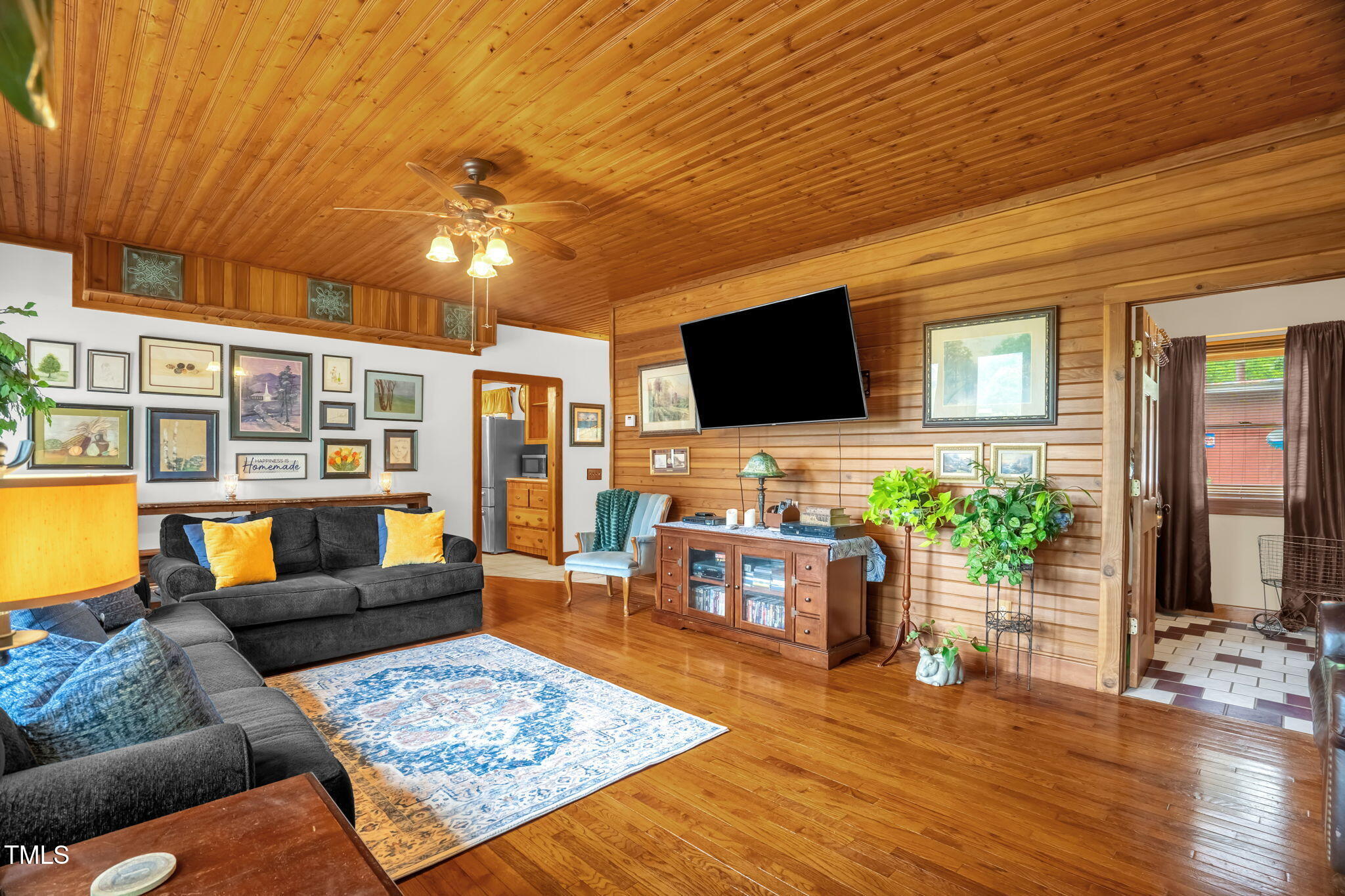 771 Cedar Grove Church Road Roxboro, NC 27574 - Photo 7 of 45 a living room with furniture and a flat screen tv