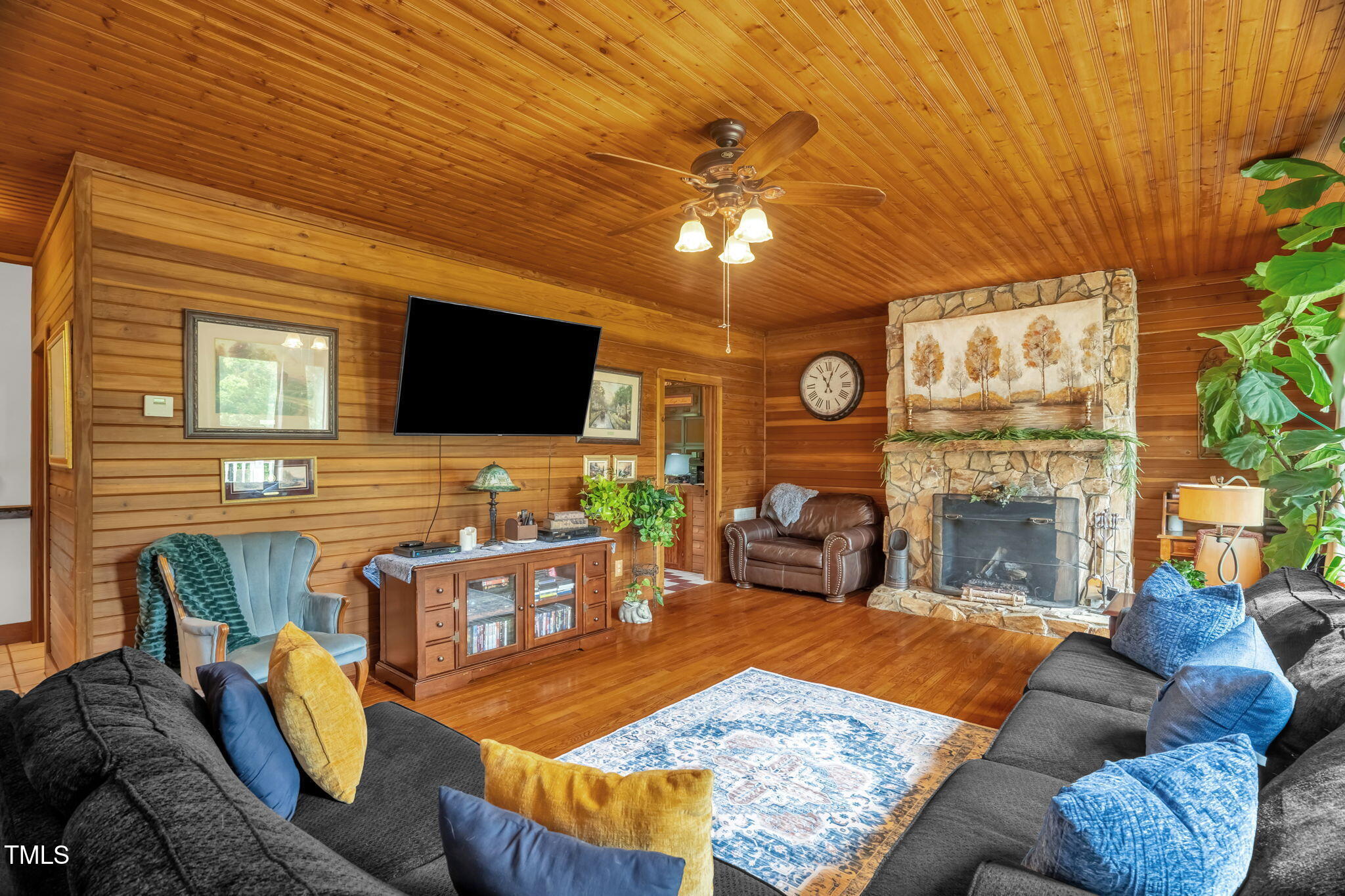 771 Cedar Grove Church Road Roxboro, NC 27574 - Photo 8 of 45 a living room with furniture and a flat screen tv