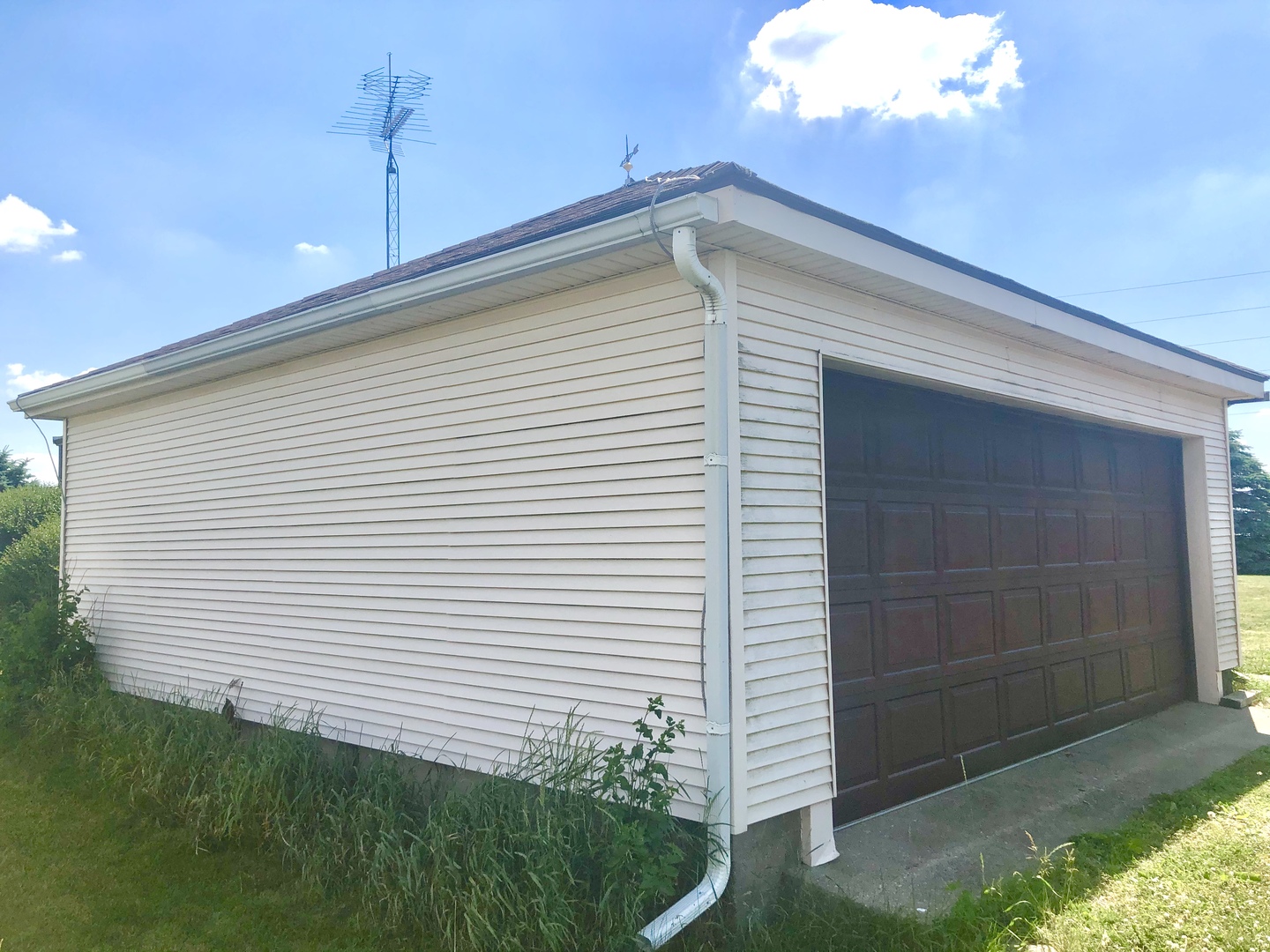 1810 Ashton Road Ashton, IL 61006 - Photo 25 of 30 a view of a house with a yard and potted plants