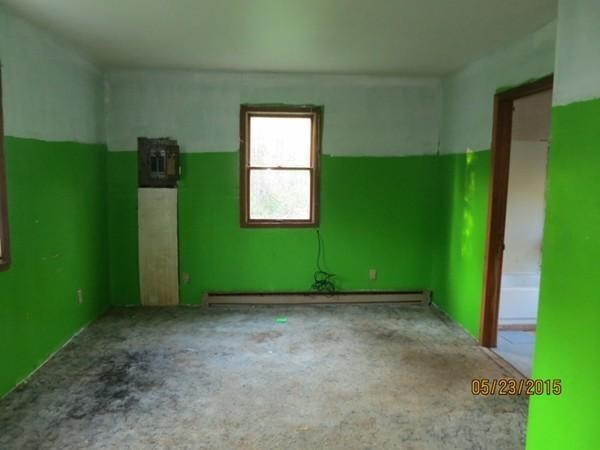 15 Curtin Road Peru, MA 01235 - Photo 9 of 11 a view of an empty room with wooden floor and a window