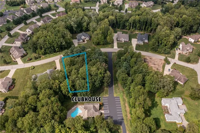 an aerial view of a house with outdoor space