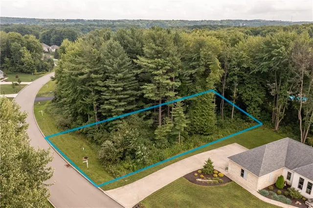 a view of a two chairs in a balcony