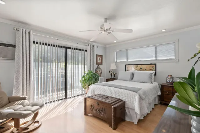 a bedroom with furniture and a window