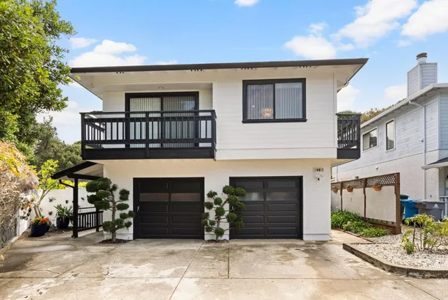 a front view of a house with yard