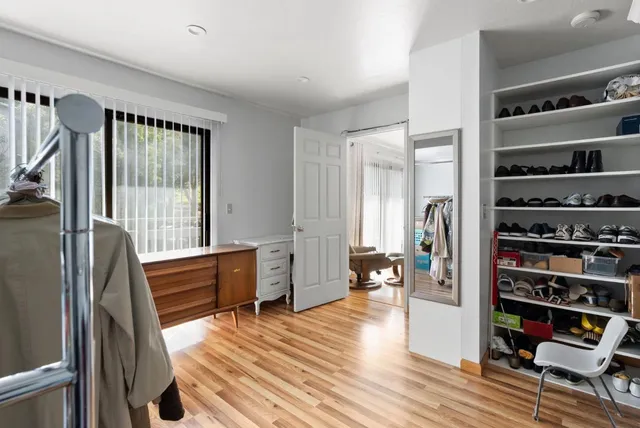 a bedroom with a workspace