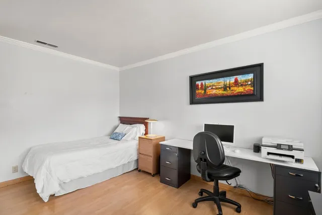 a bathroom with a shower a toilet and a sink