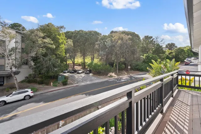 a view of a patio with table and chairs potted plants