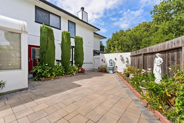 a view of a flower arrangement in front of a house