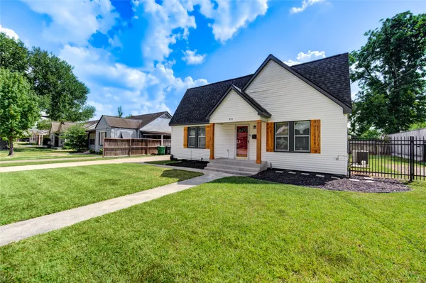 a view of a house with a yard porch and sitting area
