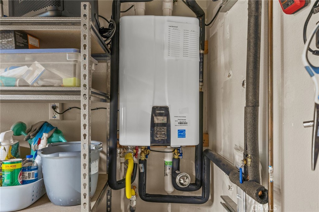 20257 Edmund Road Riverside, CA 92508 - Photo 36 of 53 a room with water heater and wooden cabinets
