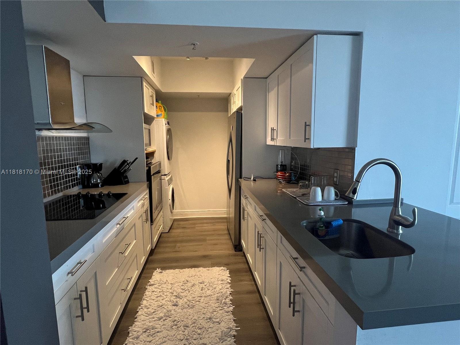 Flagami Miami, FL 33126 - Photo 2 of 8 a kitchen with stainless steel appliances a sink stove and cabinets