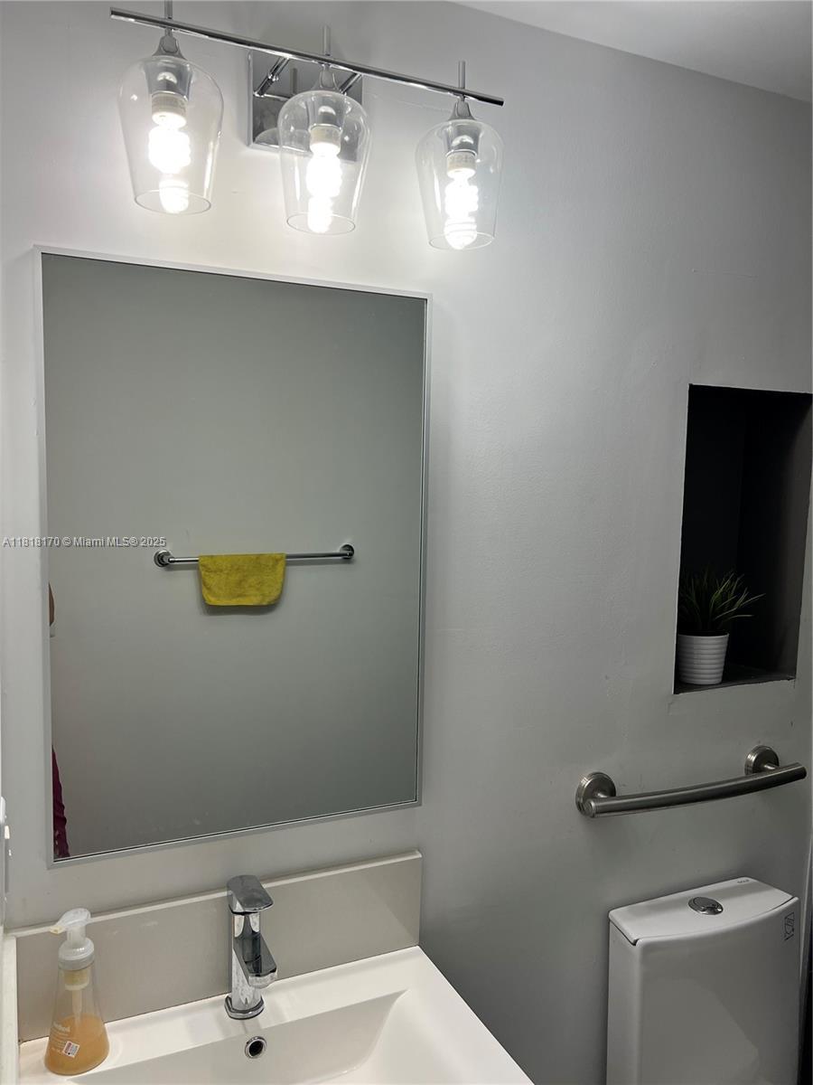 Flagami Miami, FL 33126 - Photo 5 of 8 a bathroom with a sink and a mirror