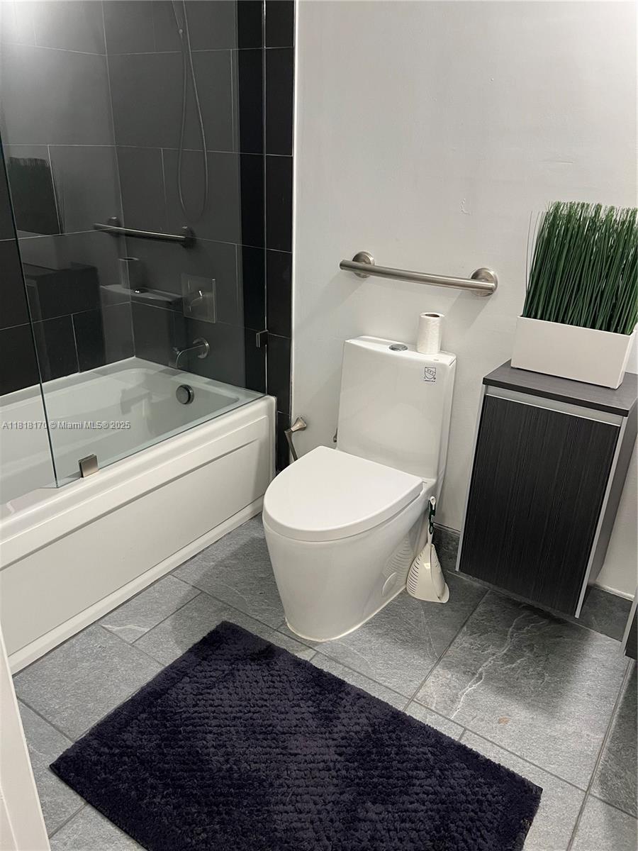 Flagami Miami, FL 33126 - Photo 6 of 8 a bathroom with a toilet a sink and bathtub