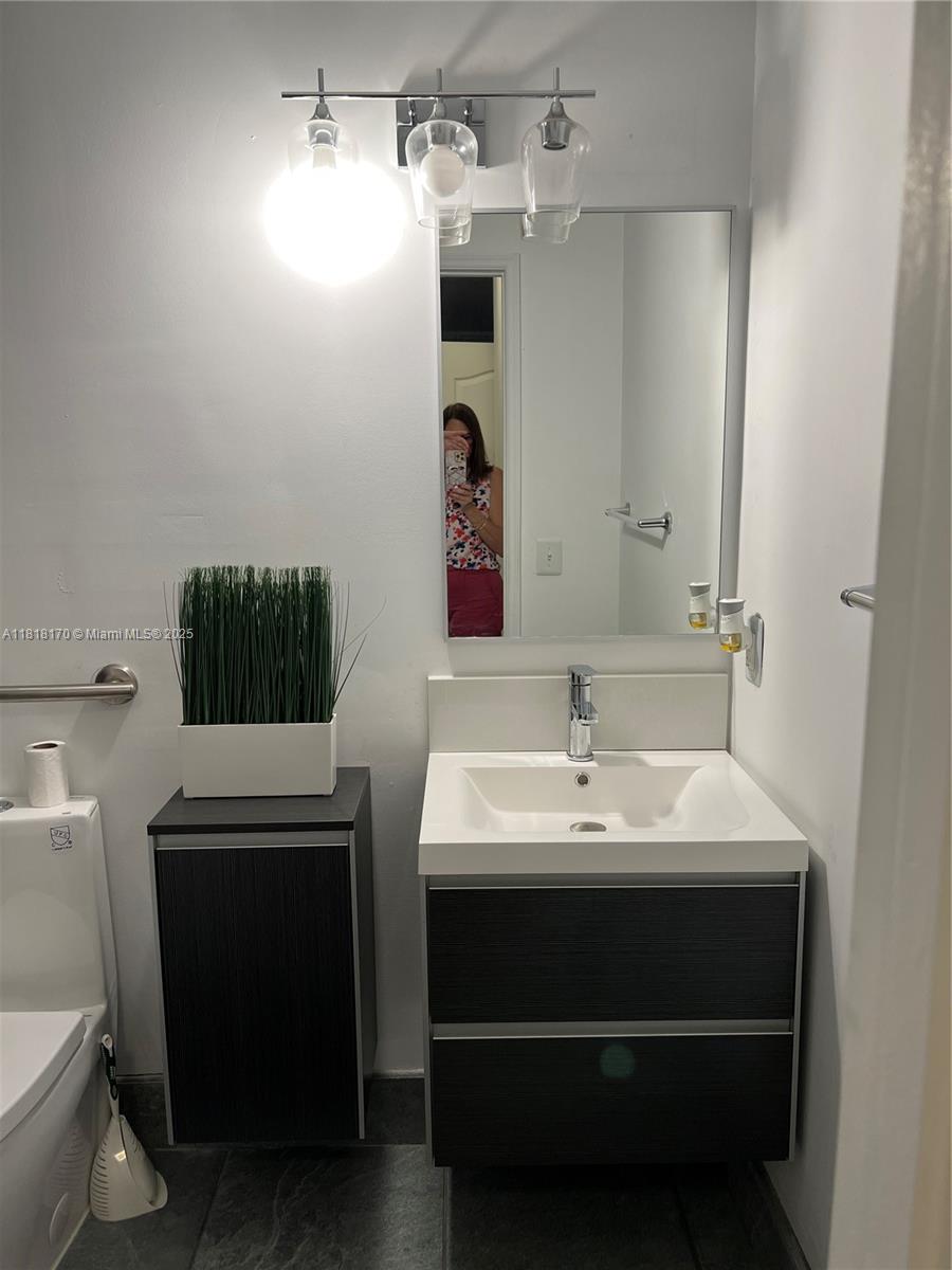 Flagami Miami, FL 33126 - Photo 7 of 8 a bathroom with a sink and a mirror
