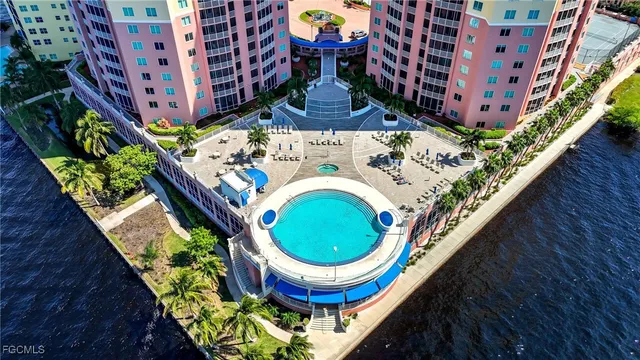 a swimming pool with outdoor seating and yard