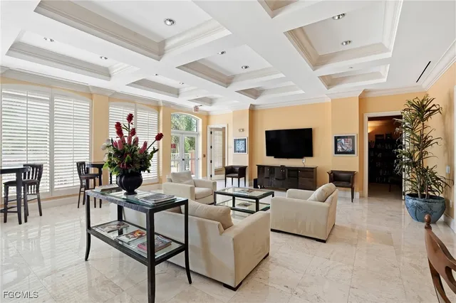 a view of a dining room with furniture and a window