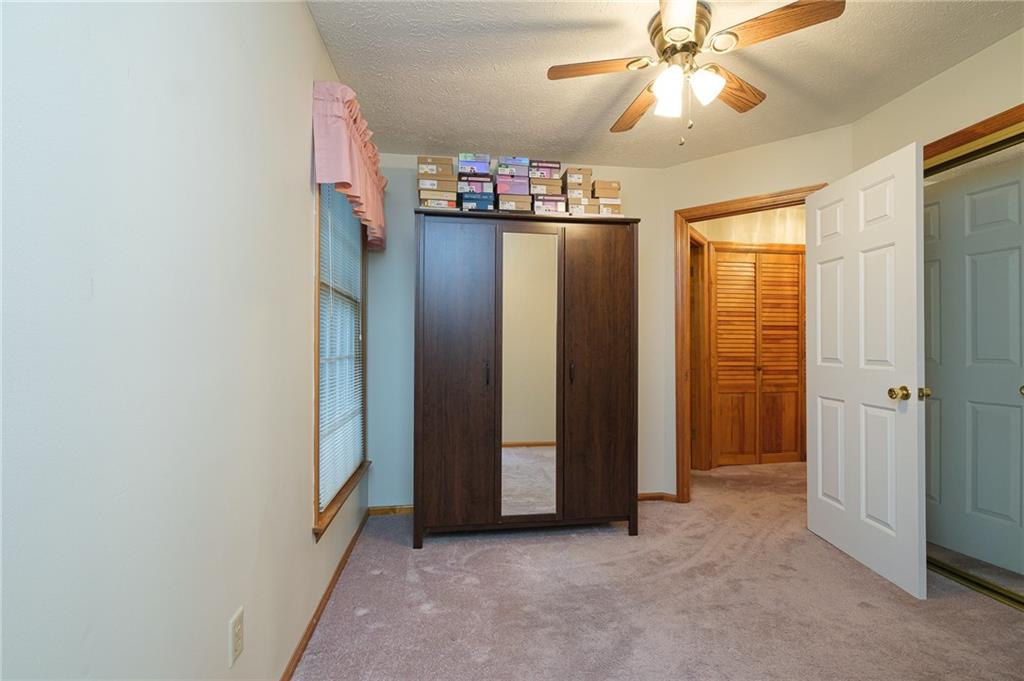 72 Midway Drive McKees Rocks, PA 15136 - Photo 19 of 25 a view of a livingroom with a chandelier fan and a window