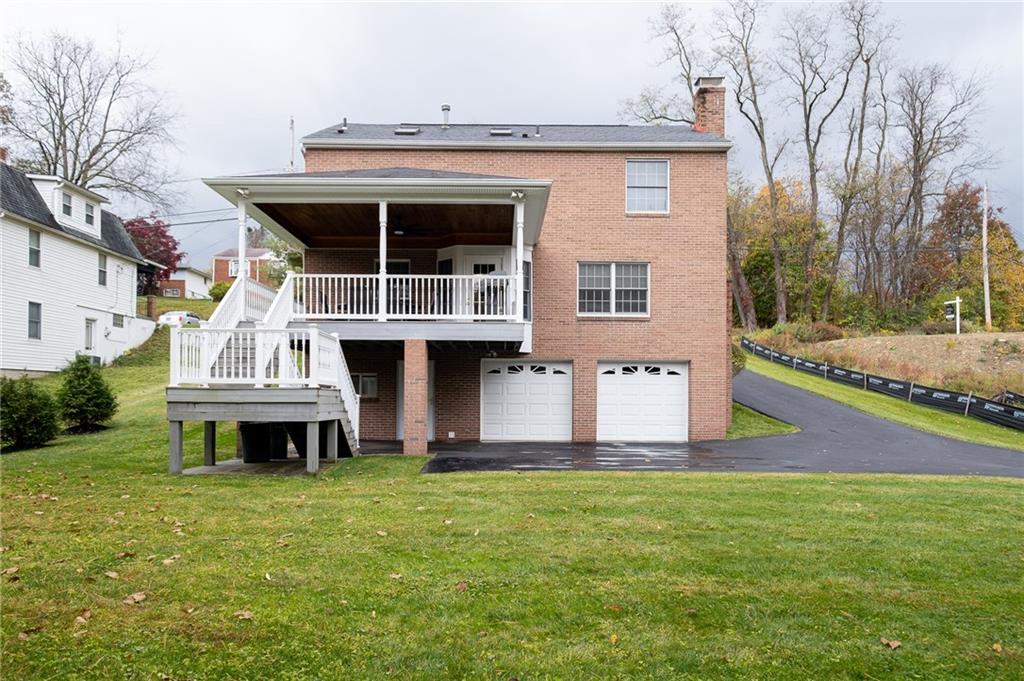 72 Midway Drive McKees Rocks, PA 15136 - Photo 25 of 25 a front view of house with yard and garage