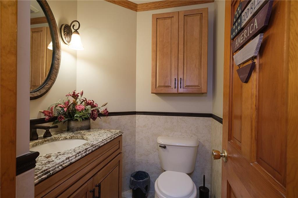 72 Midway Drive McKees Rocks, PA 15136 - Photo 7 of 25 a bathroom with a granite countertop sink and a mirror