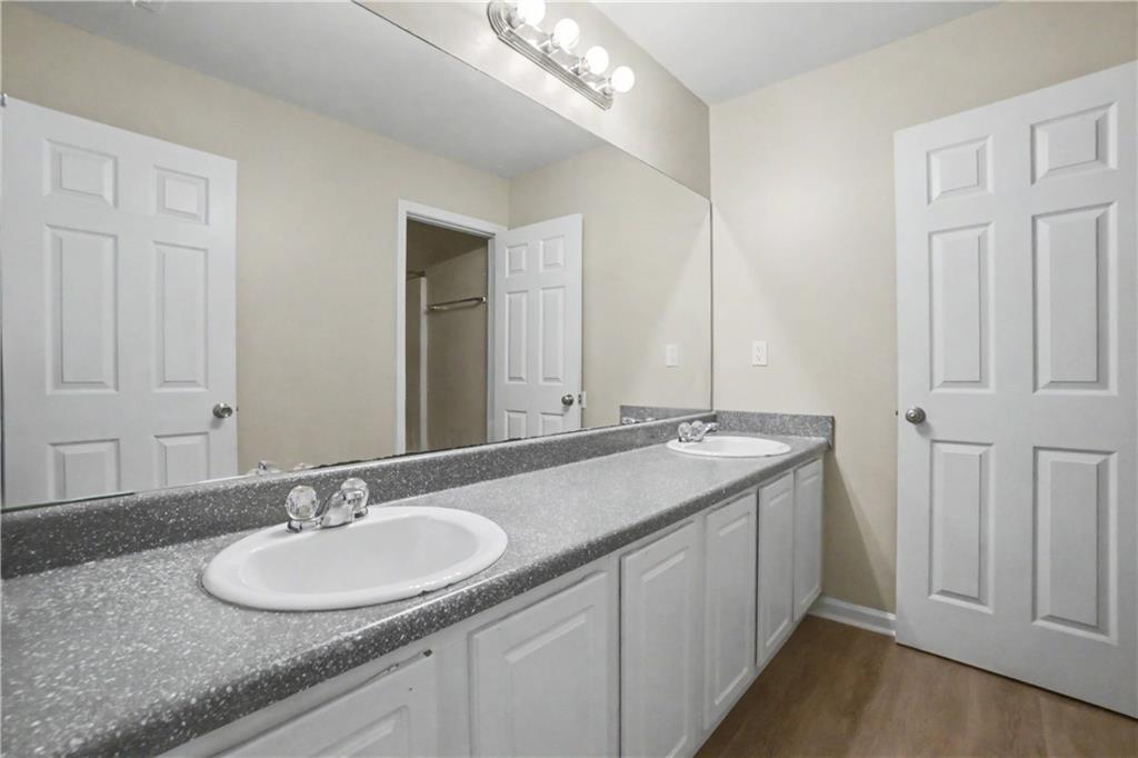 375 Walton View Fairburn, GA 30213 - Photo 20 of 38 a bathroom with a double vanity sink and a mirror