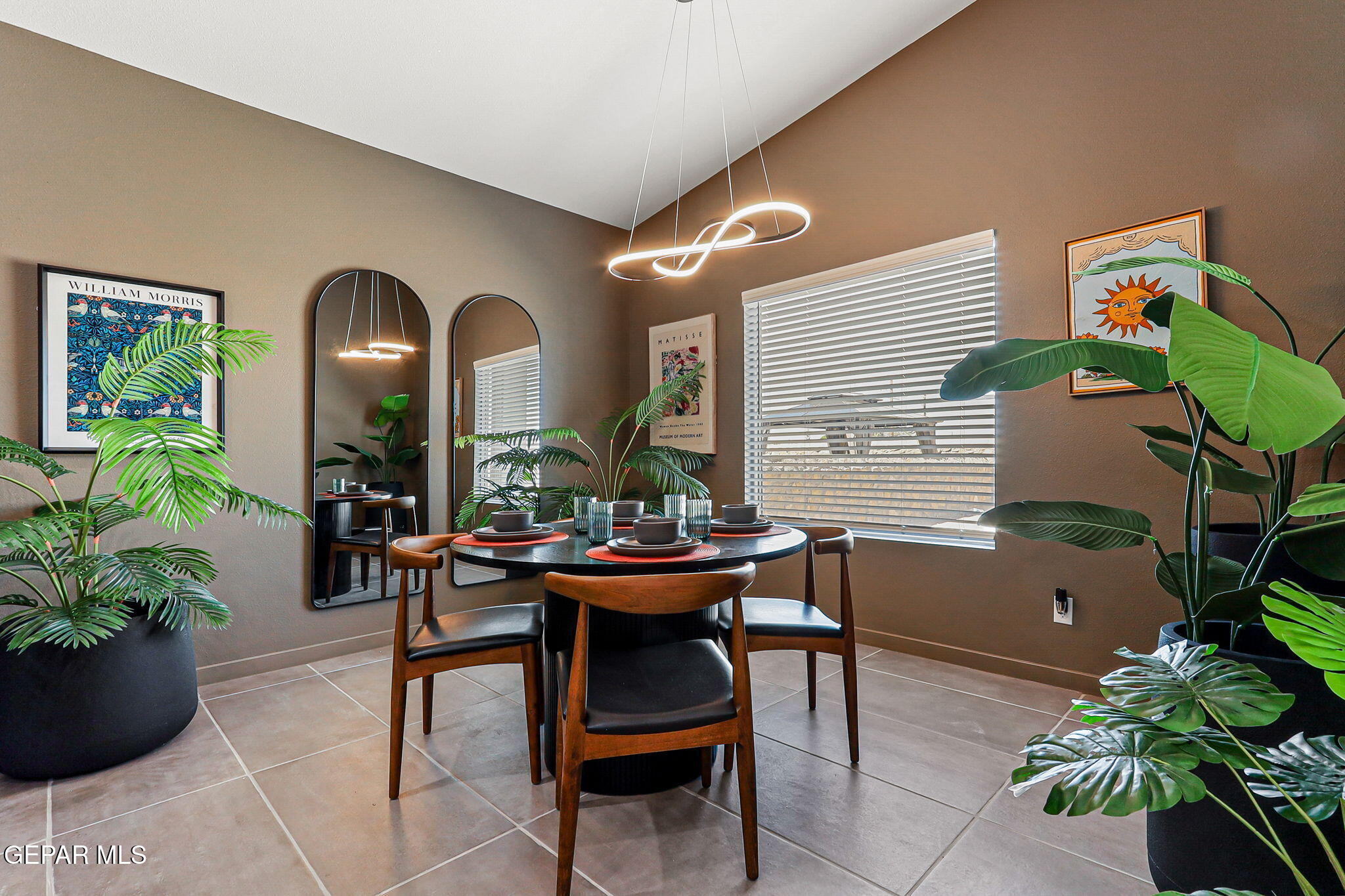 605 Espa Court Vinton, TX 79821 - Photo 11 of 31 a view of a dining room with furniture and a potted plant
