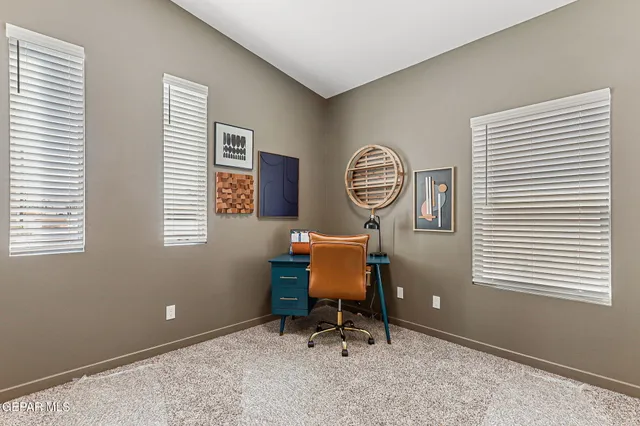 a workspace with furniture and a window