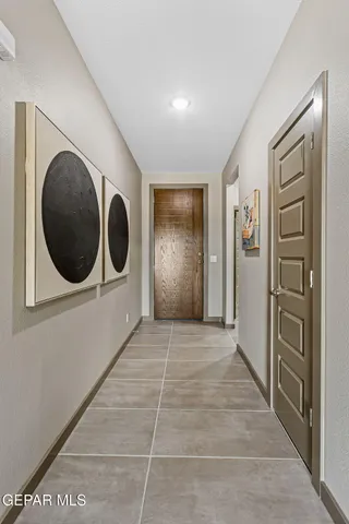 a view of a hallway with washer and dryer