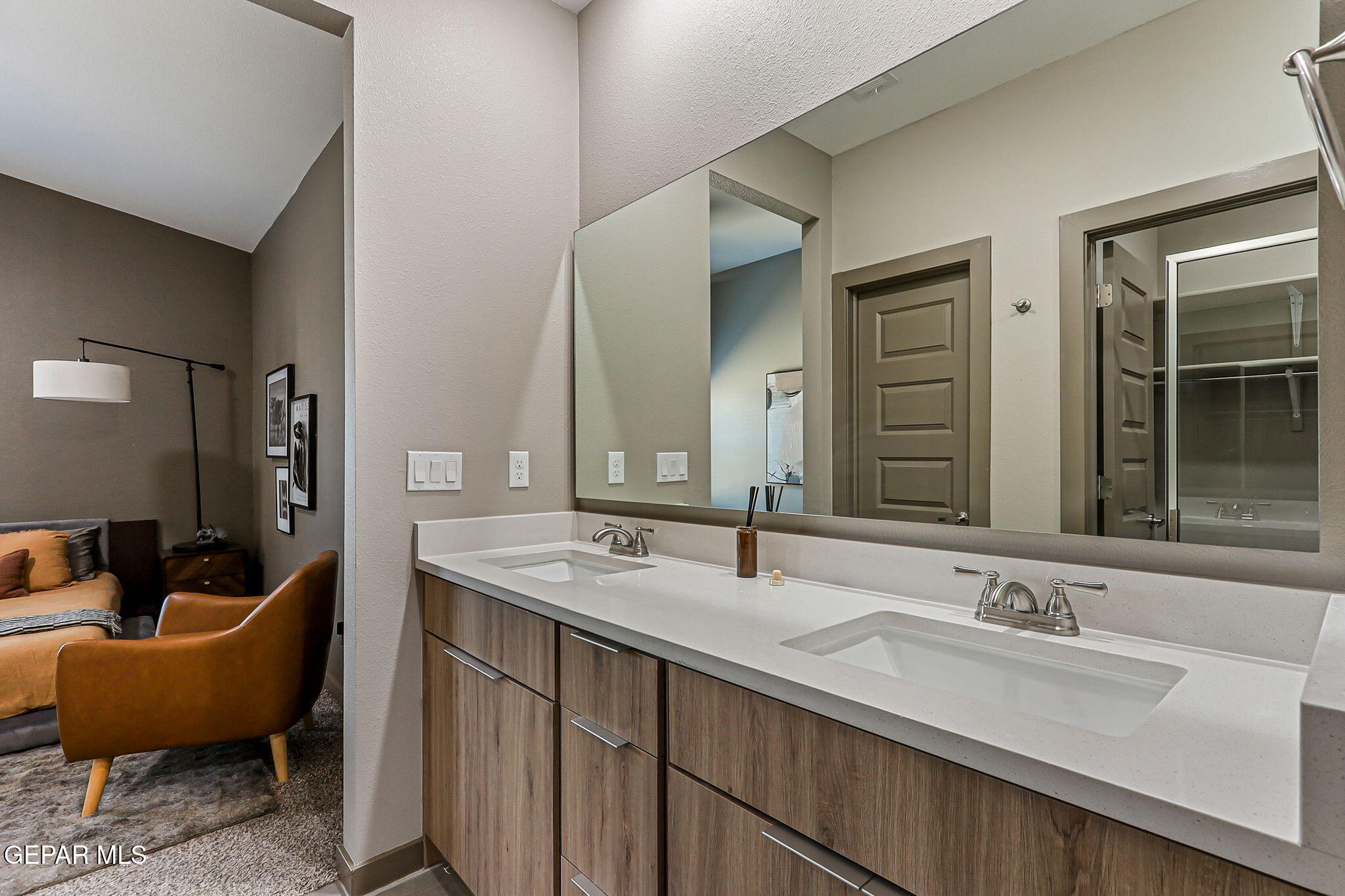 605 Espa Court Vinton, TX 79821 - Photo 23 of 31 a bathroom with double vanity sinks and a large mirror