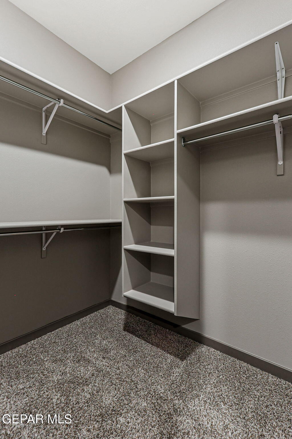 605 Espa Court Vinton, TX 79821 - Photo 29 of 31 a room with walk in closet and empty racks