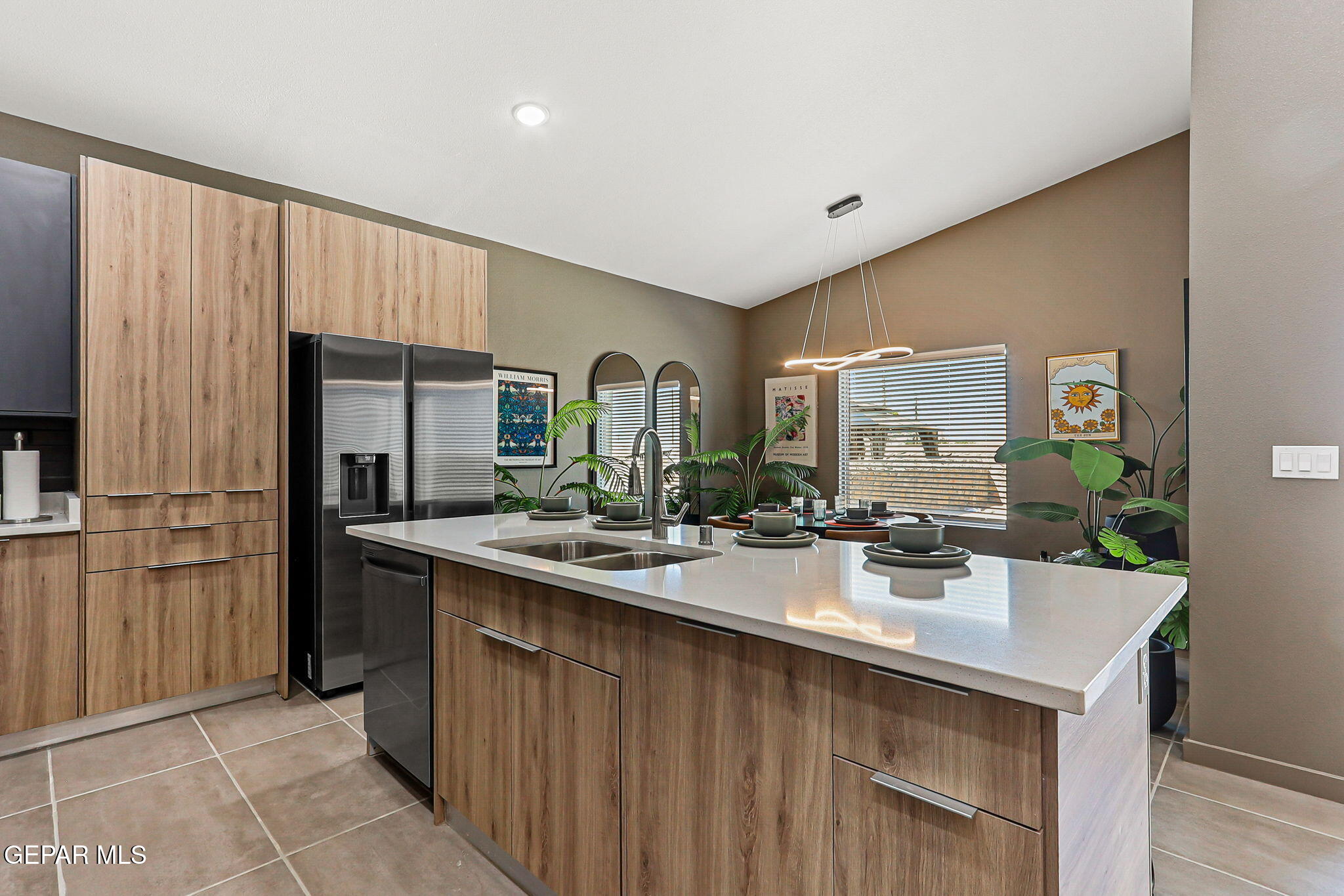 605 Espa Court Vinton, TX 79821 - Photo 4 of 31 a kitchen with sink refrigerator and cabinets
