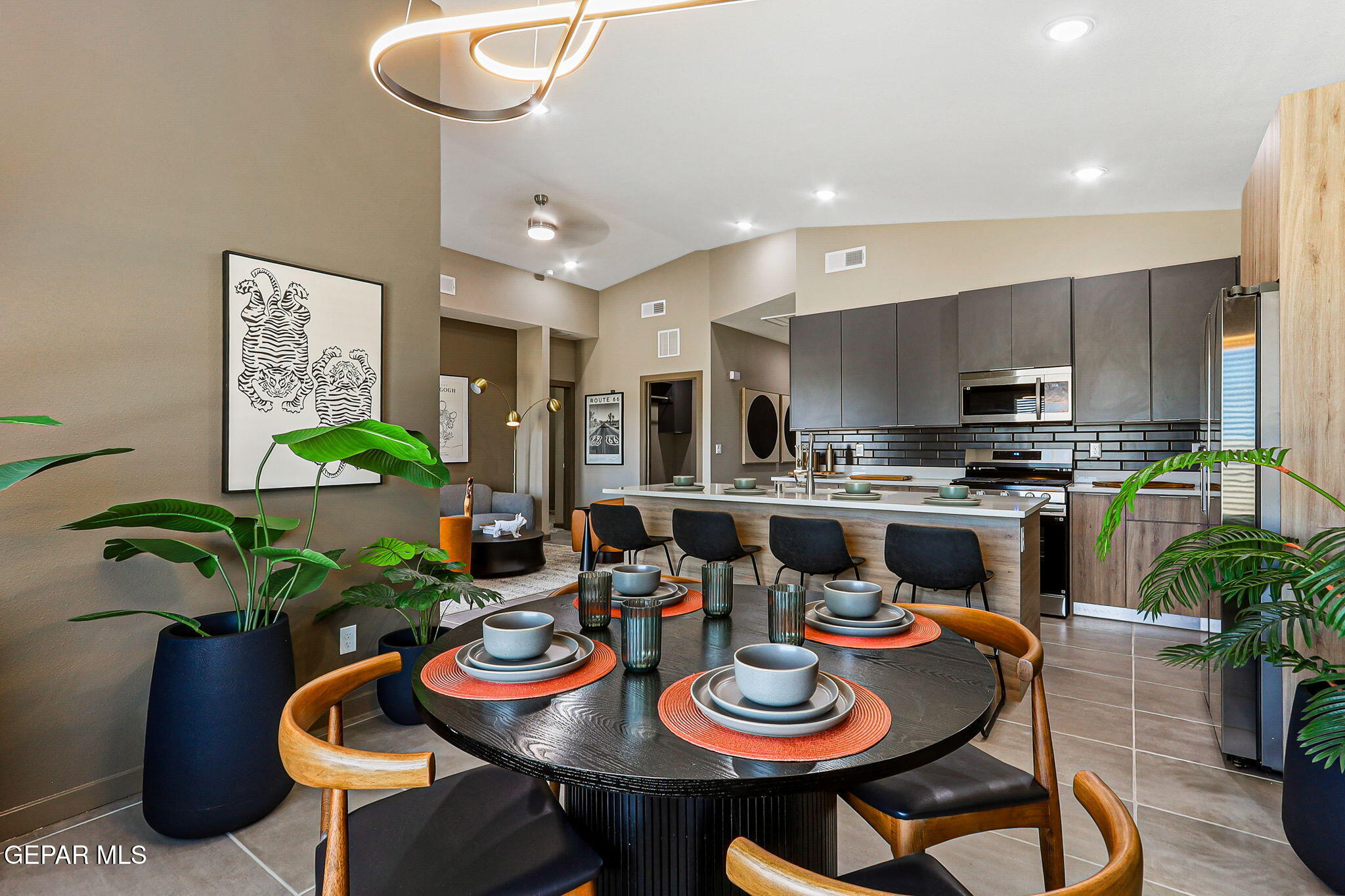 605 Espa Court Vinton, TX 79821 - Photo 10 of 31 a kitchen with a sink dining table and chairs