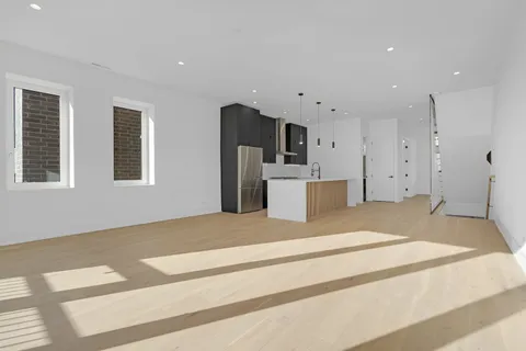 a bedroom with a bed and a television