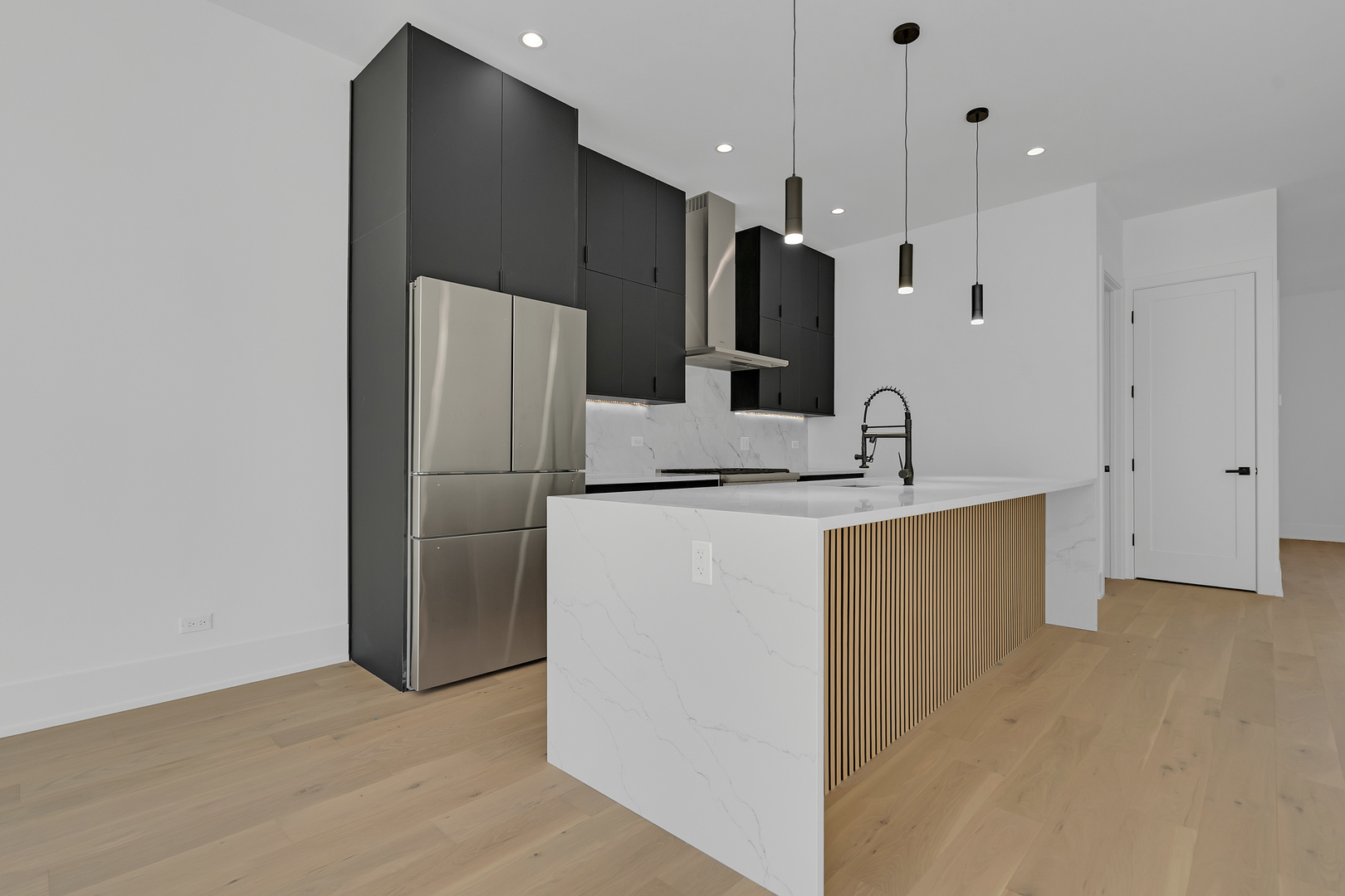 505 West Elm Street, Unit 7 Chicago, IL 60610 - Photo 14 of 36 a kitchen with kitchen island a refrigerator and a sink