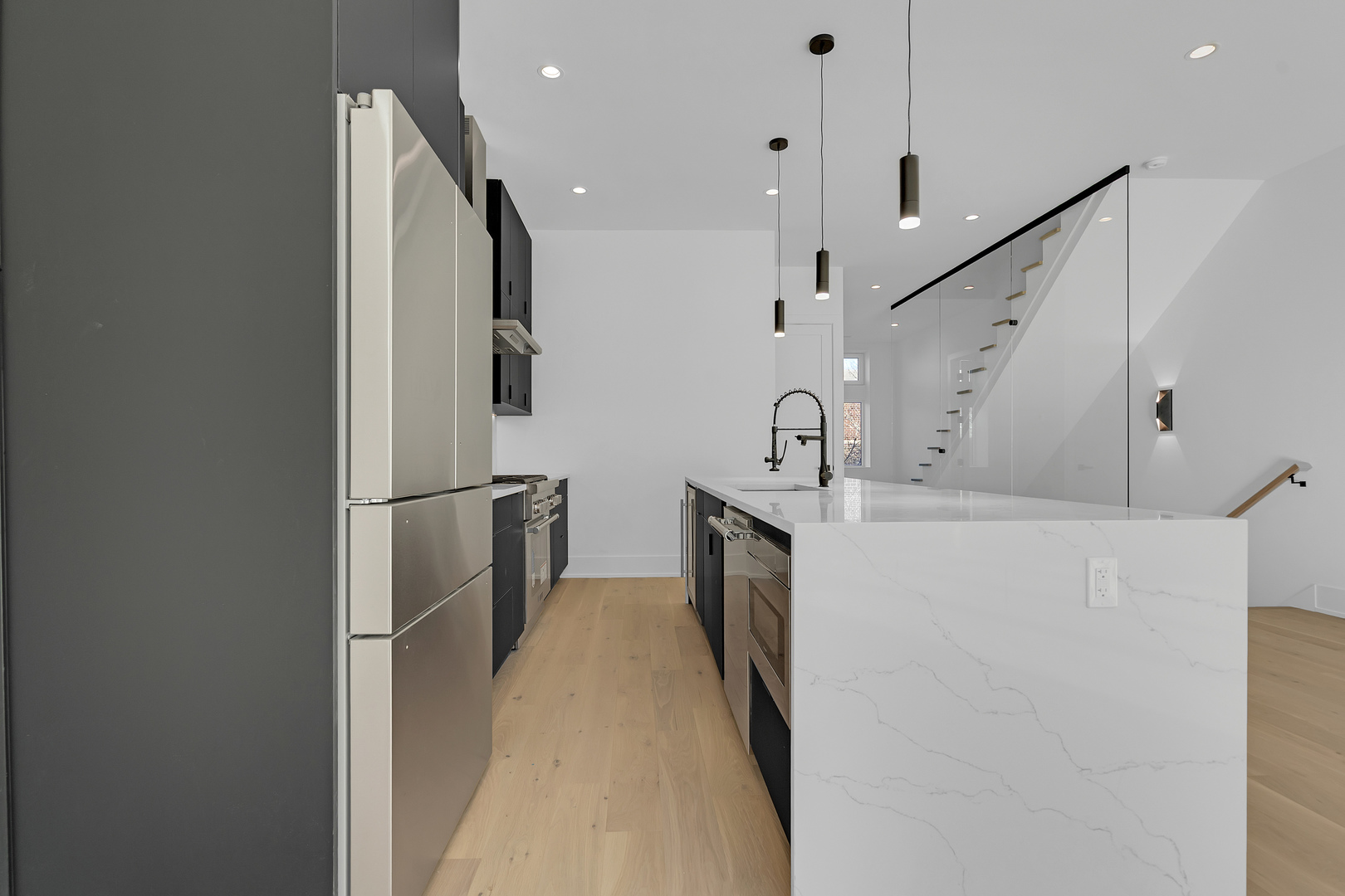 505 West Elm Street, Unit 7 Chicago, IL 60610 - Photo 15 of 36 a kitchen with cabinets and stainless steel appliances