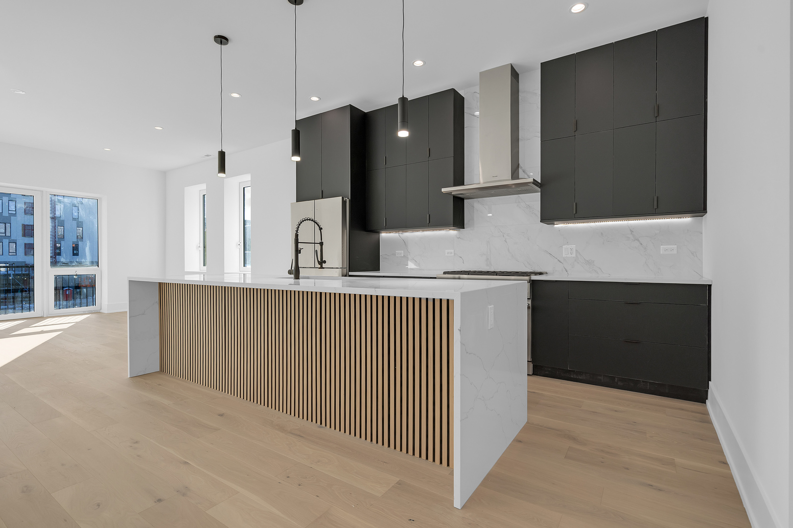 505 West Elm Street, Unit 7 Chicago, IL 60610 - Photo 17 of 36 a kitchen with stainless steel appliances a refrigerator and a sink