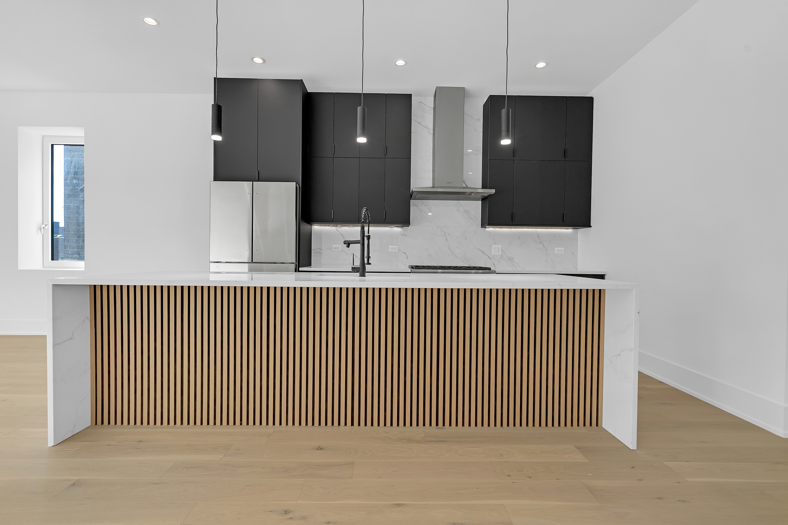 505 West Elm Street, Unit 7 Chicago, IL 60610 - Photo 9 of 36 a view of a kitchen from the hallway