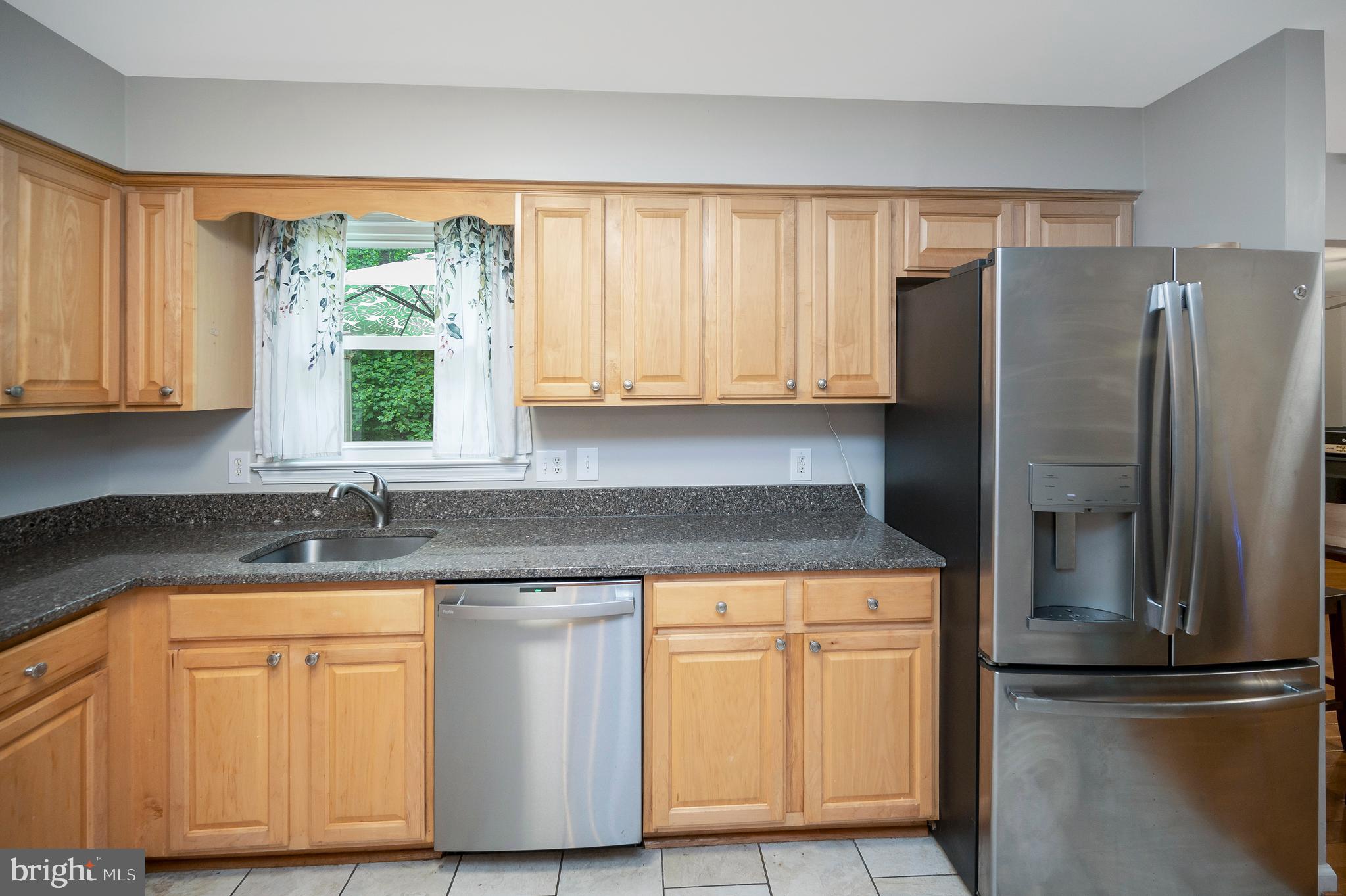 679 Cropp Road Fredericksburg, VA 22406 - Photo 17 of 39 a kitchen with stainless steel appliances granite countertop a refrigerator sink and cabinets
