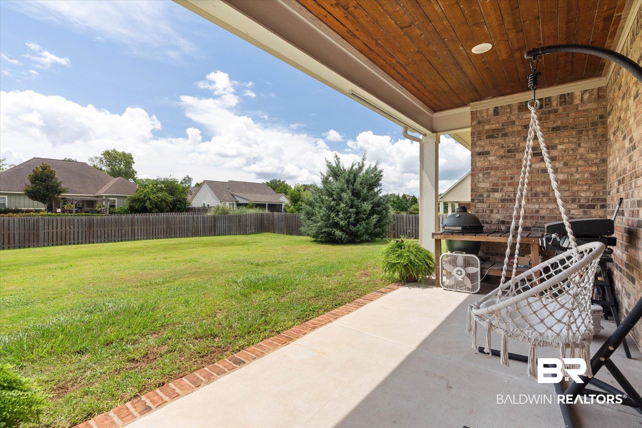 24821 Austin Road Daphne, AL 36526 - Photo 18 of 24 Fenced backyard with a patio area